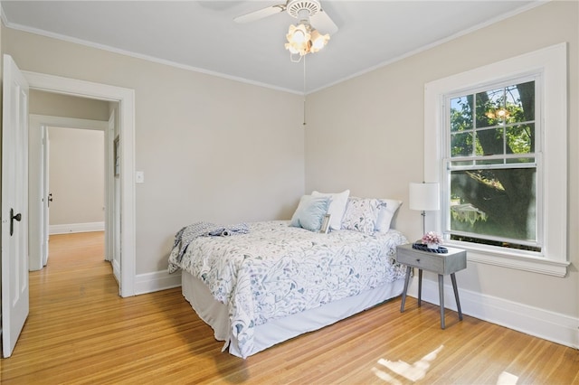 234 Pine Grove Ave, Irondequoit, NY 14617 - bedroom featuring light wood-type flooring, crown molding, and ceiling fan