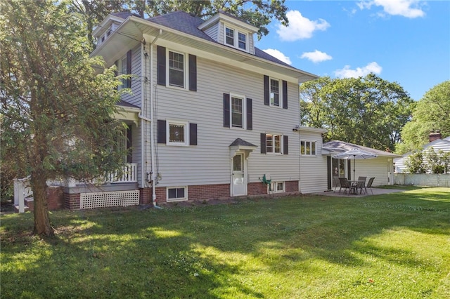234 Pine Grove Ave, Irondequoit, NY 14617 - back of property with a lawn and a patio area