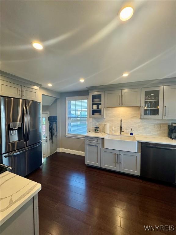 149 Wrexham Ct S, Tonawanda, NY 14150 - kitchen featuring stainless steel refrigerator with ice dispenser, dishwashing machine, gray cabinetry, tasteful backsplash, and glass insert cabinets
