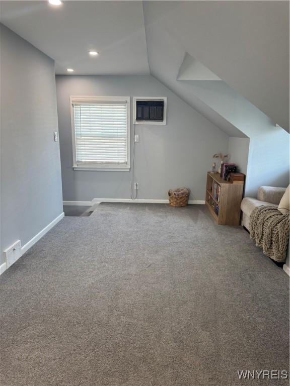 149 Wrexham Ct S, Tonawanda, NY 14150 - bonus room with a wall unit AC, carpet flooring, lofted ceiling, and recessed lighting