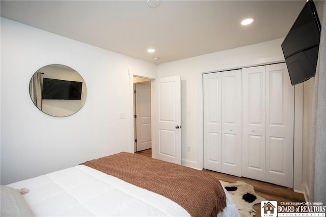 6064 Nys Rte 242 E, Ellicottville, NY 14731 - bedroom with wood finished floors, recessed lighting, and a closet