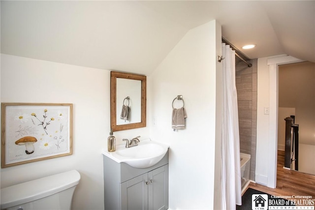 6064 Nys Rte 242 E, Ellicottville, NY 14731 - full bathroom featuring vaulted ceiling, vanity, wood finished floors, and shower / bath combo with shower curtain