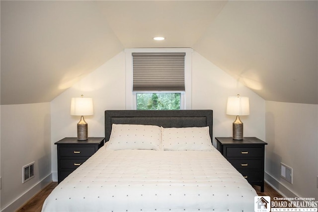 6064 Nys Rte 242 E, Ellicottville, NY 14731 - bedroom with dark wood-type flooring, vaulted ceiling, and recessed lighting