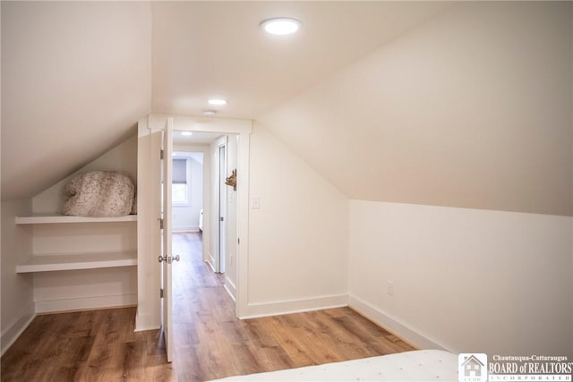 6064 Nys Rte 242 E, Ellicottville, NY 14731 - additional living space with wood finished floors, lofted ceiling, and recessed lighting