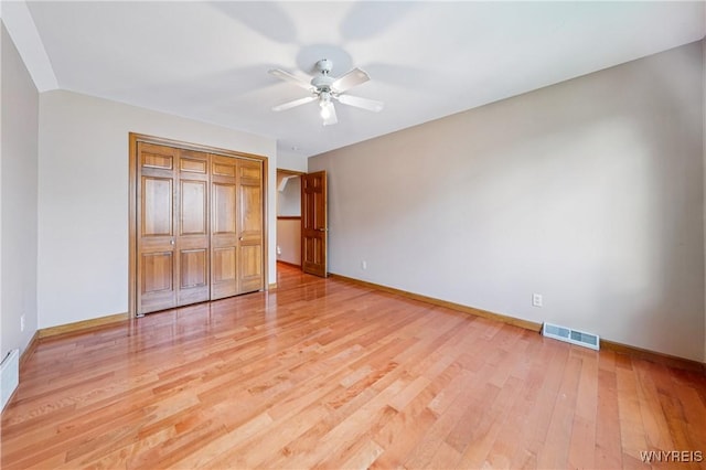 100 Hunt Club Cir, Amherst, NY 14051 - unfurnished bedroom featuring light wood-type flooring, a closet, and a ceiling fan
