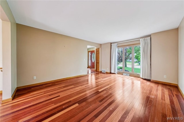 100 Hunt Club Cir, Amherst, NY 14051 - unfurnished room with hardwood / wood-style flooring and baseboards