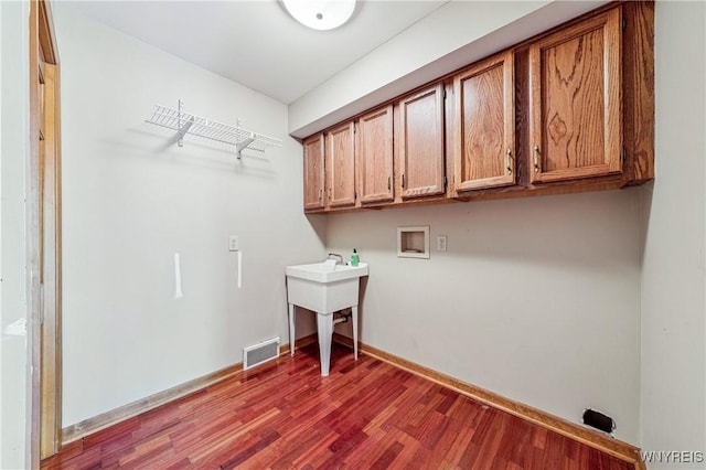 100 Hunt Club Cir, Amherst, NY 14051 - laundry area featuring hookup for a washing machine, cabinet space, and wood finished floors