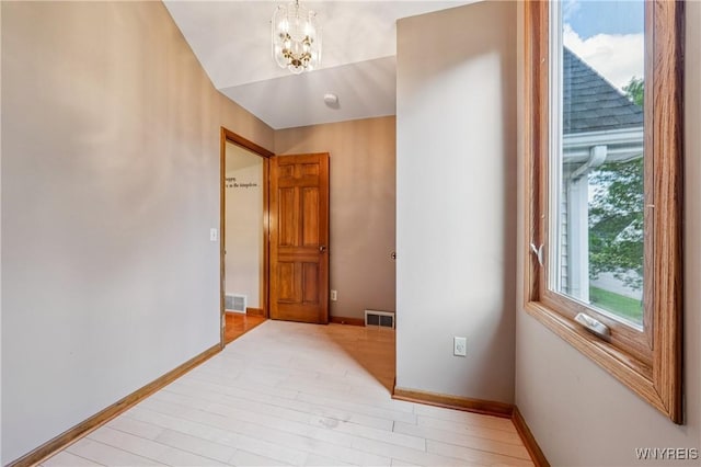 100 Hunt Club Cir, Amherst, NY 14051 - corridor featuring a chandelier and light wood-style flooring