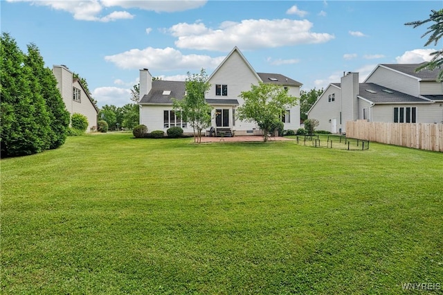 100 Hunt Club Cir, Amherst, NY 14051 - back of property with a patio area and a chimney