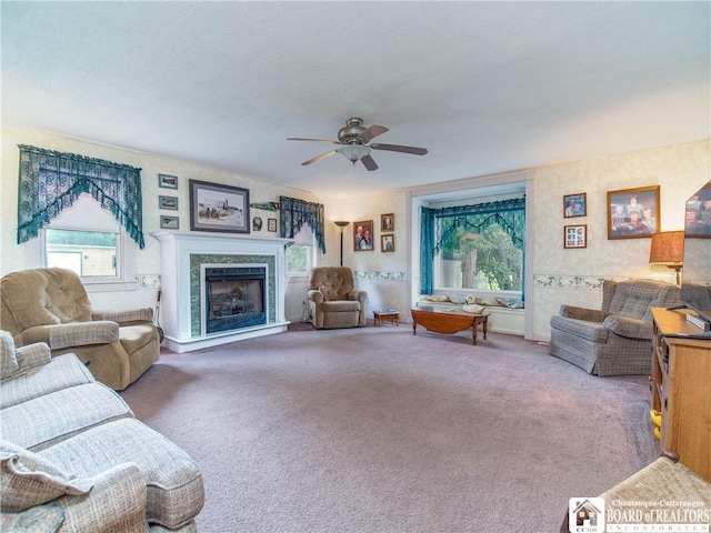 6295 Stockton Hartfield Rd, Chautauqua, NY 14728 - living room featuring plenty of natural light, ceiling fan, a fireplace with raised hearth, and carpet floors