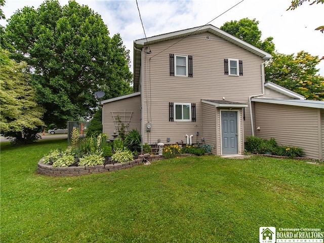 6295 Stockton Hartfield Rd, Chautauqua, NY 14728 - back of house featuring a yard