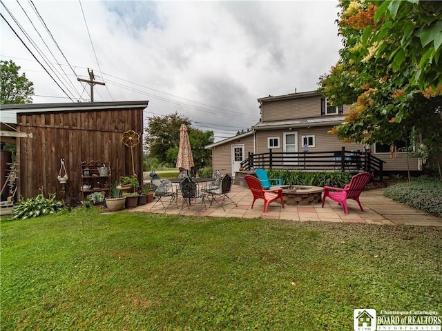 6295 Stockton Hartfield Rd, Chautauqua, NY 14728 - view of green lawn with a fire pit and a patio