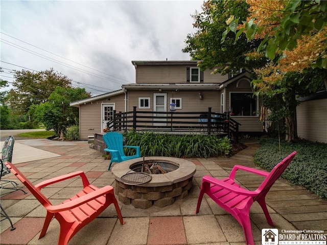 6295 Stockton Hartfield Rd, Chautauqua, NY 14728 - view of patio featuring an outdoor fire pit and a deck