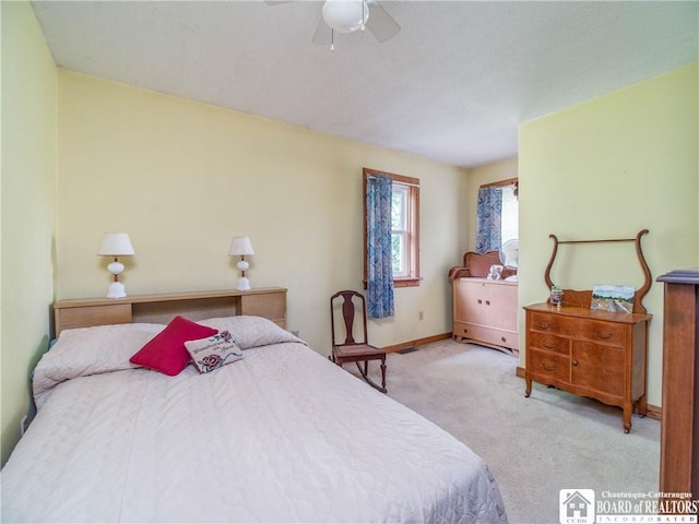 6295 Stockton Hartfield Rd, Chautauqua, NY 14728 - carpeted bedroom with baseboards and ceiling fan