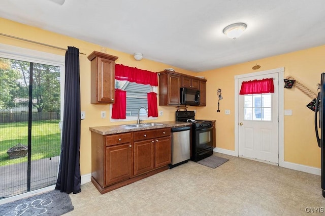 213 Roxann Ave, Cicero, NY 13212 - kitchen with black appliances, healthy amount of natural light, light countertops, and light floors