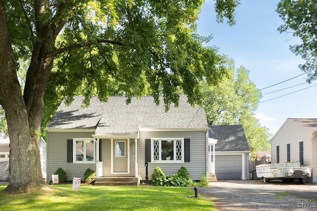213 Roxann Ave, Cicero, NY 13212 - view of front of property featuring driveway, a garage, a front lawn, entry steps, and roof with shingles