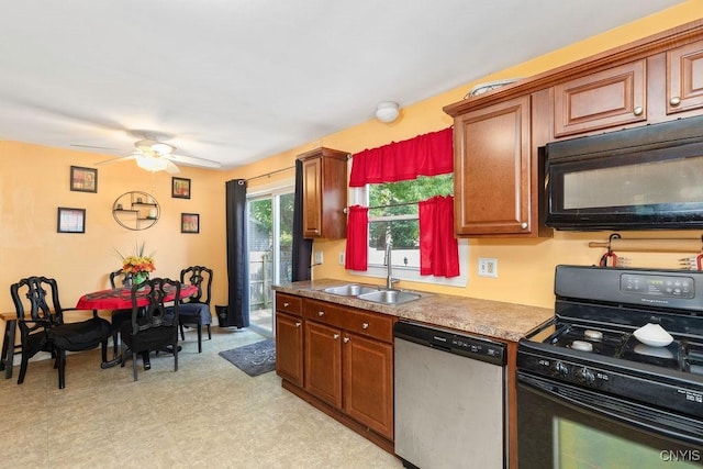 213 Roxann Ave, Cicero, NY 13212 - kitchen with black appliances, a ceiling fan, light floors, and brown cabinetry