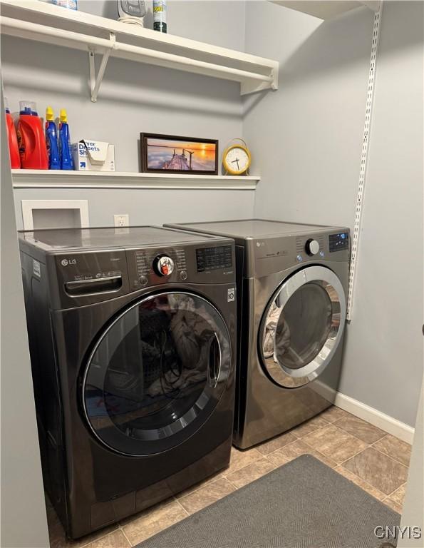 9715 Ethel Rd, Clay, NY 13029 - laundry area featuring washing machine and clothes dryer