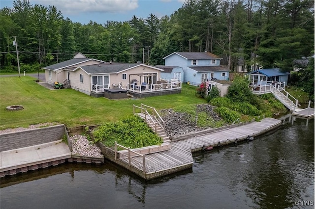 9715 Ethel Rd, Clay, NY 13029 - back of house with stairway, a deck with water view, a lawn, and a forest view