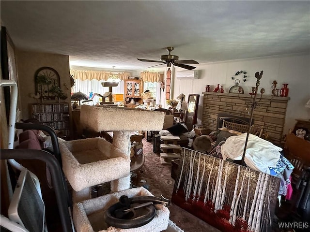 3902 Calkins Rd, Porter, NY 14174 - living room with an AC wall unit, a ceiling fan, and a stone fireplace