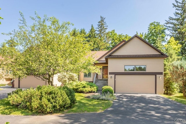 42 Nursery Ln, Syracuse, NY 13210 - view of front of property with asphalt driveway and an attached garage