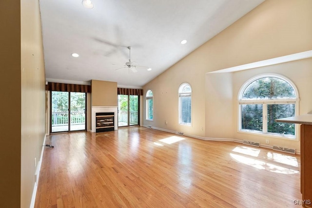 42 Nursery Ln, Syracuse, NY 13210 - unfurnished living room featuring healthy amount of natural light, a ceiling fan, high vaulted ceiling, recessed lighting, and a fireplace