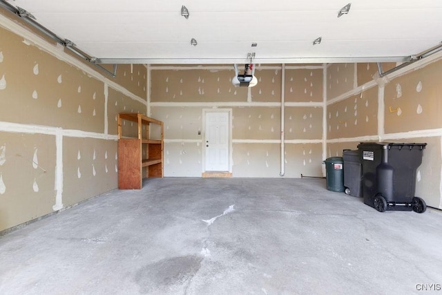 42 Nursery Ln, Syracuse, NY 13210 - garage featuring a garage door opener