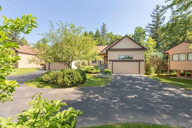 42 Nursery Ln, Syracuse, NY 13210 - view of front of property with asphalt driveway and an attached garage