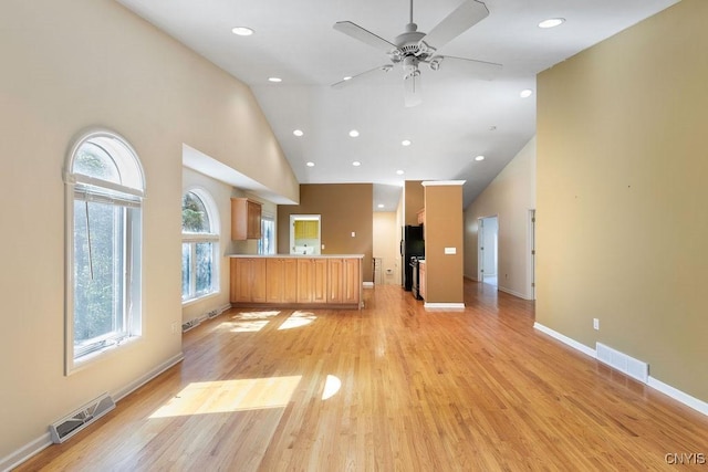 42 Nursery Ln, Syracuse, NY 13210 - unfurnished living room with ceiling fan, recessed lighting, light wood-style floors, and high vaulted ceiling