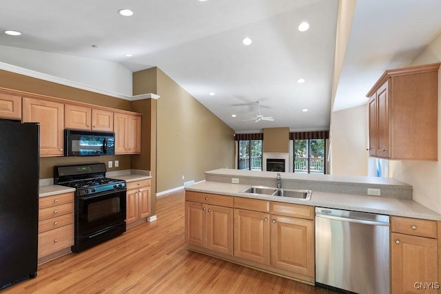 42 Nursery Ln, Syracuse, NY 13210 - kitchen with black appliances, lofted ceiling, light wood-type flooring, light countertops, and ceiling fan