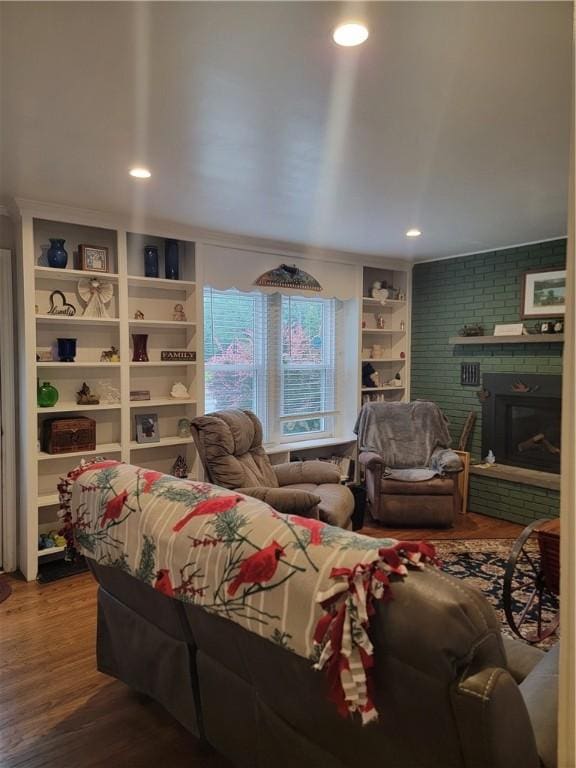 244 State Highway 320, Norwich, NY 13815 - living area featuring a brick fireplace, wood finished floors, recessed lighting, and built in features
