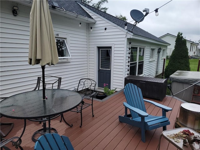 244 State Highway 320, Norwich, NY 13815 - wooden terrace featuring a hot tub and outdoor dining space