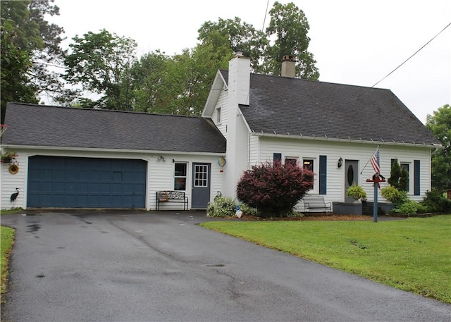 244 State Highway 320, Norwich, NY 13815 - cape cod house featuring a garage, driveway, a chimney, a front yard, and roof with shingles