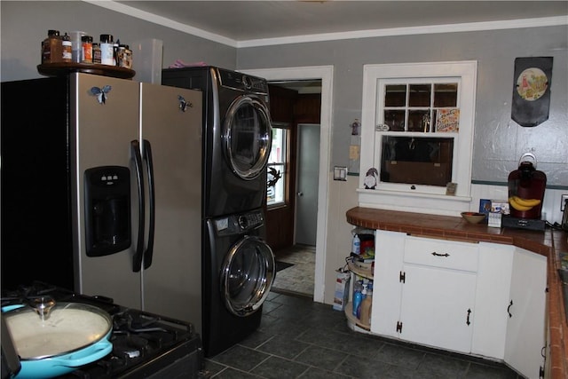 244 State Highway 320, Norwich, NY 13815 - laundry area with stacked washing machine and dryer and crown molding