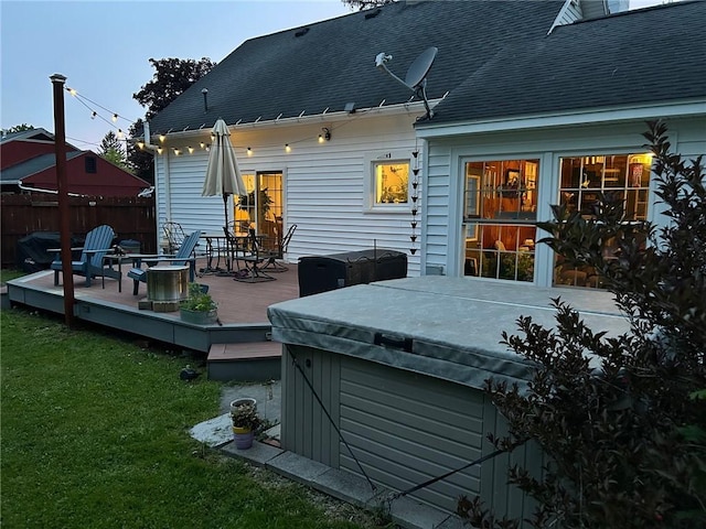 244 State Highway 320, Norwich, NY 13815 - back of property with a wooden deck, a hot tub, and roof with shingles
