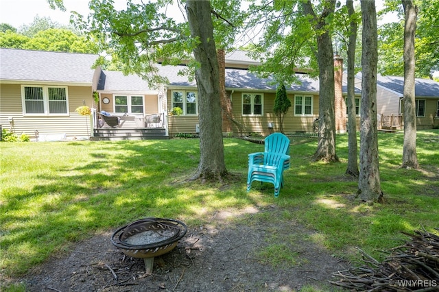 253 Old Oak Post Rd, Amherst, NY 14051 - view of grassy yard with a fire pit and a deck