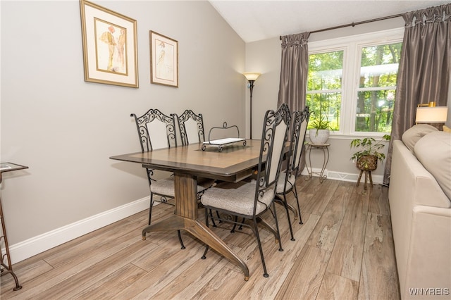 253 Old Oak Post Rd, Amherst, NY 14051 - dining space featuring light wood-style flooring and lofted ceiling