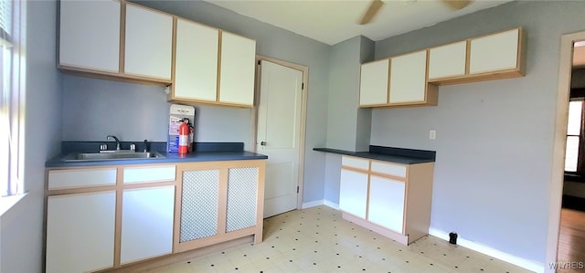 425 12th St, Niagara Falls, NY 14303 - kitchen with light flooring, dark countertops, and ceiling fan