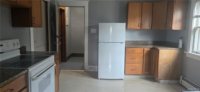 425 12th St, Niagara Falls, NY 14303 - kitchen with white appliances, a baseboard heating unit, brown cabinets, and light flooring