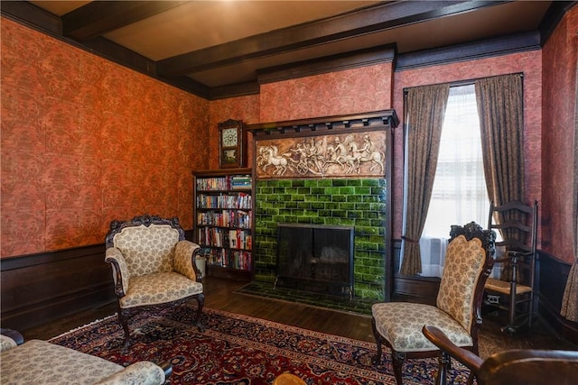 407 W Church St, Elmira City, NY 14901 - sitting room featuring wood finished floors, a fireplace, beam ceiling, and wallpapered walls