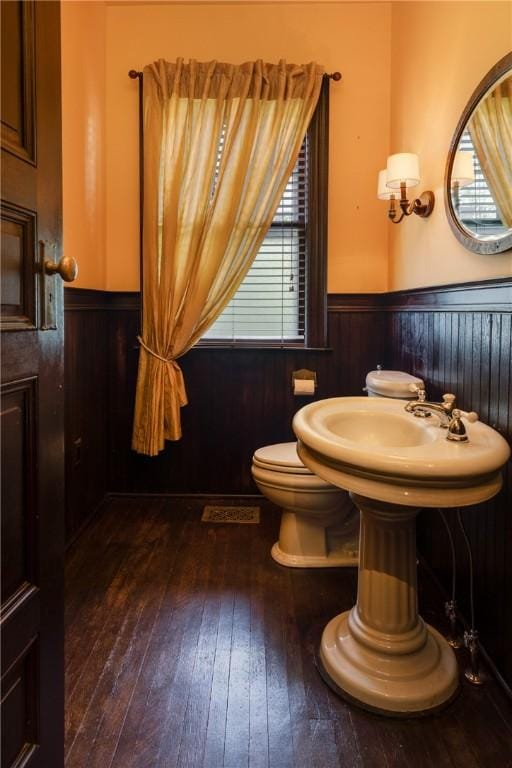 407 W Church St, Elmira City, NY 14901 - half bath featuring a wainscoted wall, wood walls, and wood-type flooring