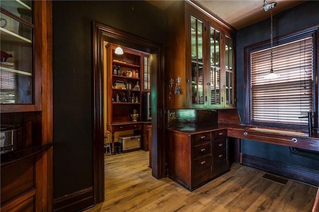 407 W Church St, Elmira City, NY 14901 - bar with wood finished floors, decorative light fixtures, and built in desk