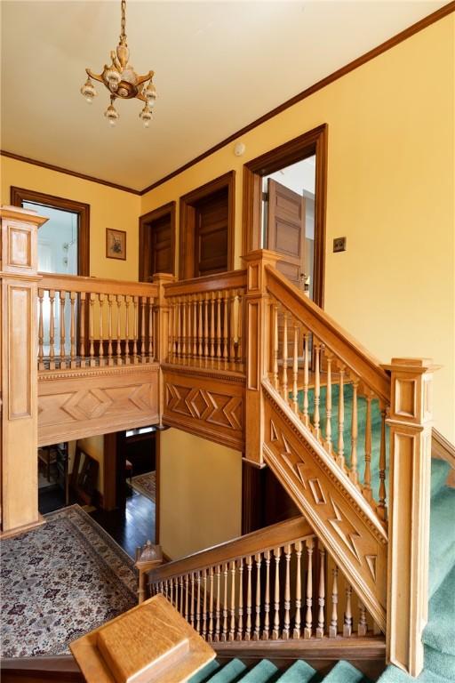 407 W Church St, Elmira City, NY 14901 - stairway with a chandelier and crown molding