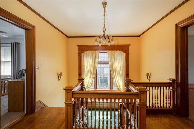 407 W Church St, Elmira City, NY 14901 - hallway featuring an upstairs landing, wood finished floors, a chandelier, and ornamental molding