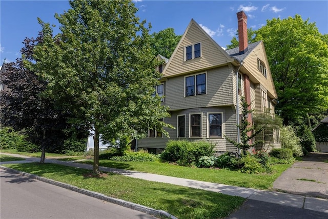 407 W Church St, Elmira City, NY 14901 - view of front of home with a front yard and a chimney