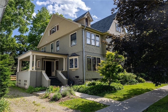 407 W Church St, Elmira City, NY 14901 - view of front of house featuring roof with shingles, a porch, and a front yard