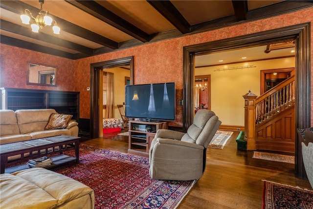 407 W Church St, Elmira City, NY 14901 - living area featuring beam ceiling, stairway, wood finished floors, a chandelier, and crown molding