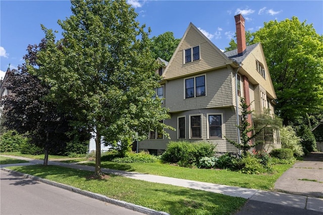 407 W Church St, Elmira City, NY 14901 - view of front of property with a chimney and a front yard