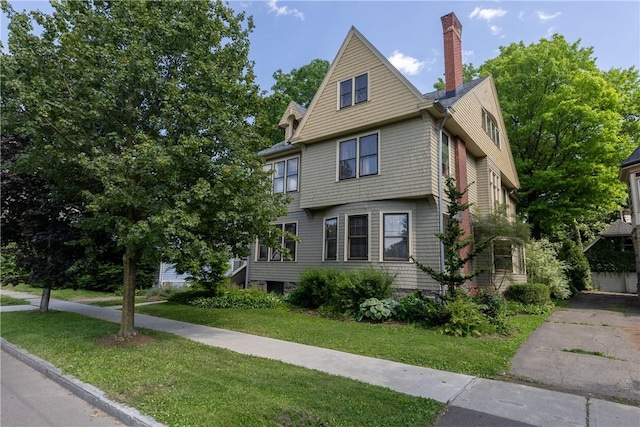 407 W Church St, Elmira City, NY 14901 - view of front of home featuring a front lawn and a chimney