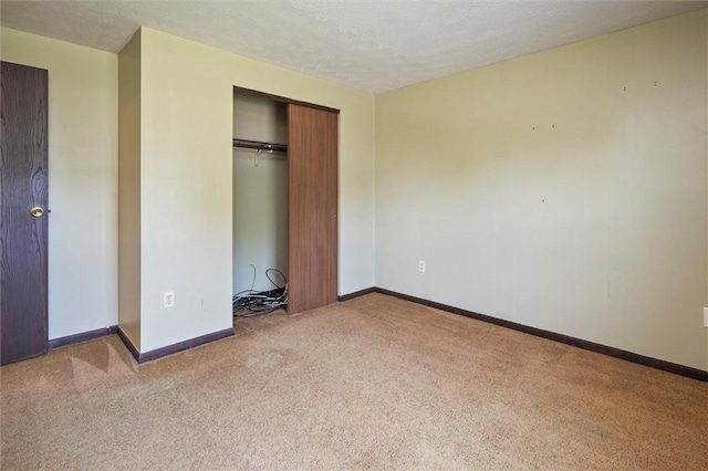 53 Alecia Dr, Greece, NY 14626 - unfurnished bedroom featuring carpet floors, a closet, and a textured ceiling